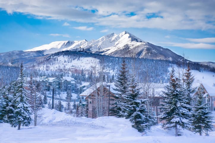 Snow-covered mountains and homes in Summit County, Colorado